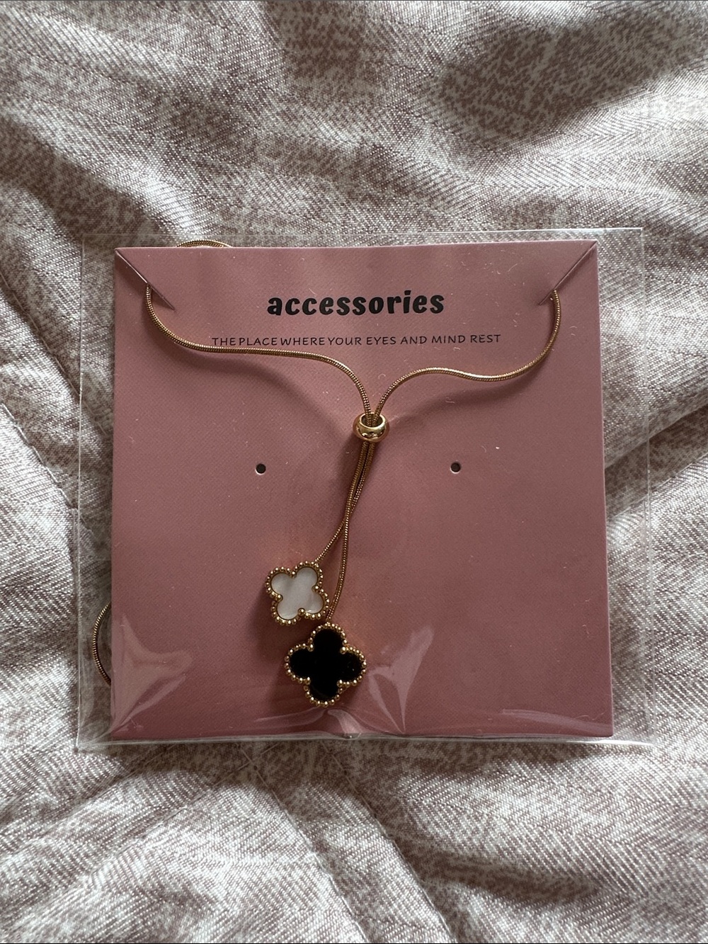 Gold Lariat Necklace with Black and White Clover Charms